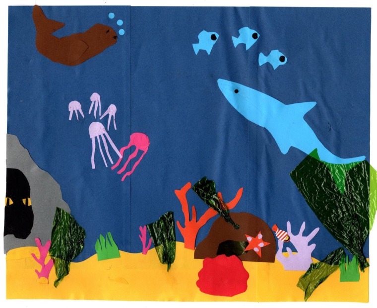 an underwater scene made out of cut paper